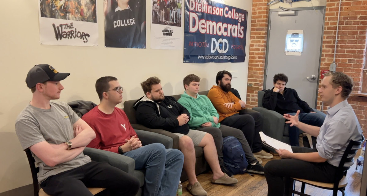 Staff Writer Samuel Pimental '28 interviewing members of the College Democrats and College Republicans. From the left: Ryan Bergh Thies '25, Trace Maneval '27,  Matthew Craig '25, Dylan Stroppa '27, Alden Miller '26 and Jack Fechter '26.